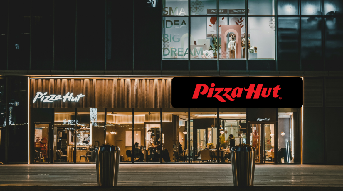 pizza hut at night with warm lit interior