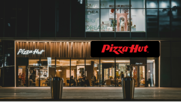 pizza hut at night with warm lit interior