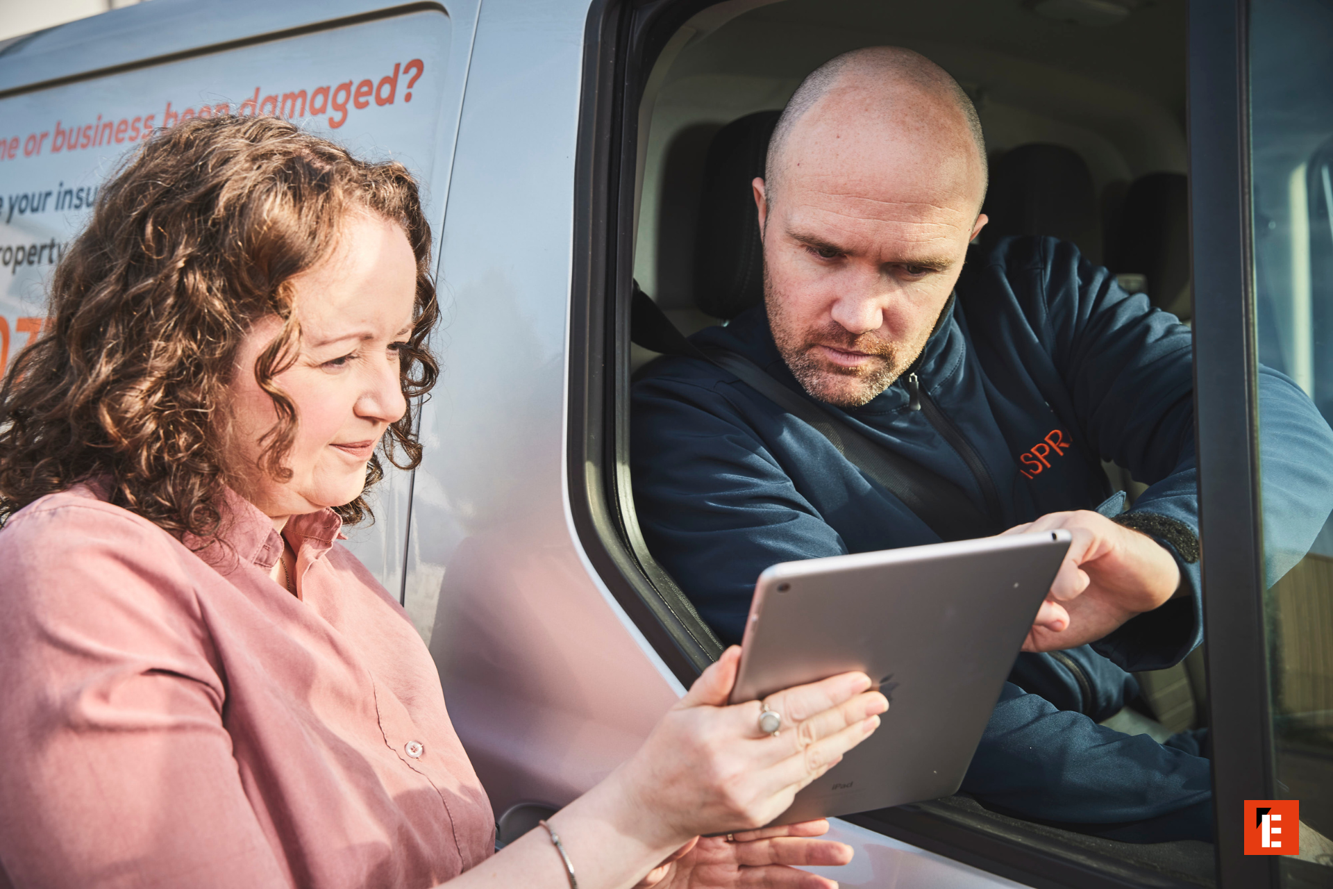 onsite technician and customer reviewing tablet