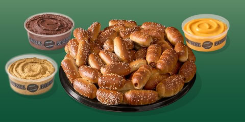 golden soft pretzel bites with three dips