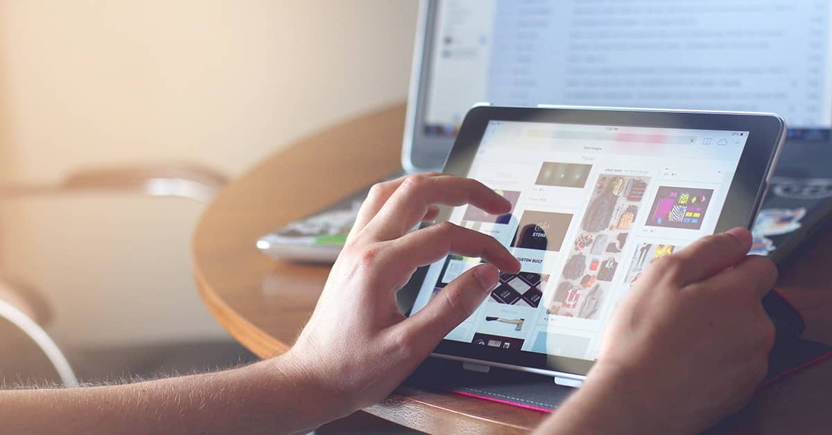 touchscreen tablet browsing in cozy home workspace