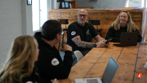 team meeting around wooden table