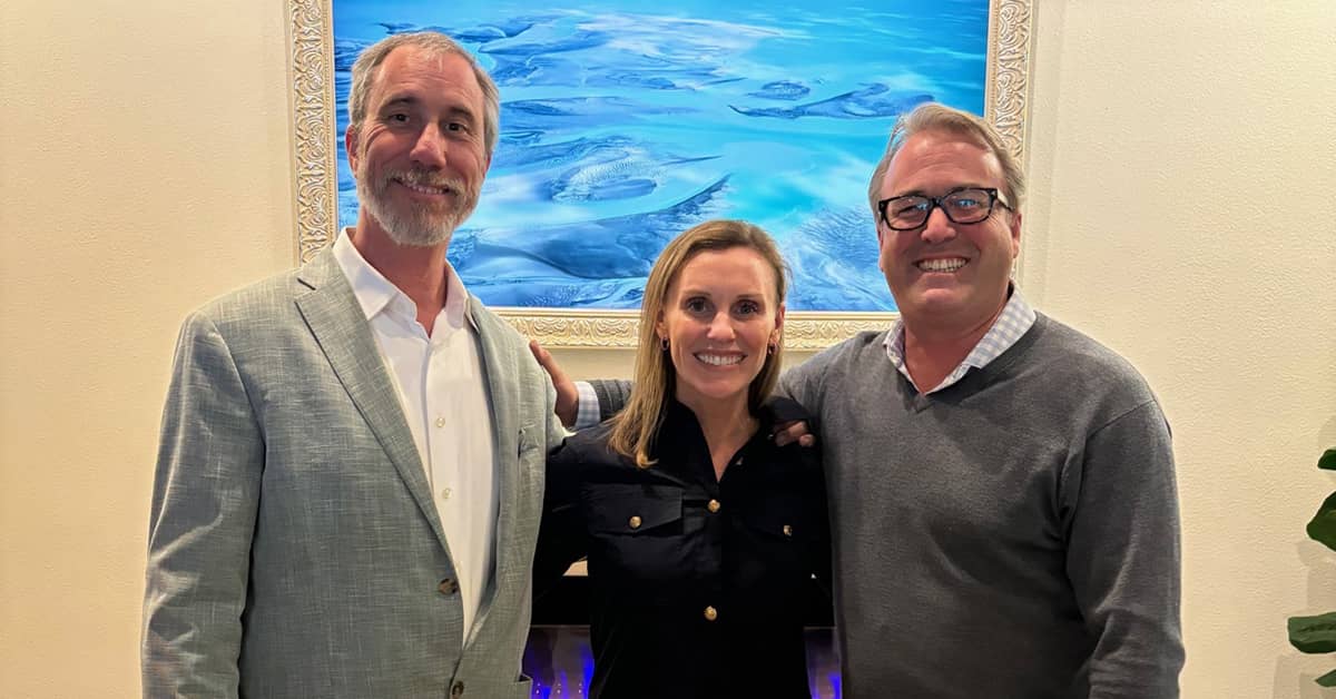 three friends smiling portrait with blue painting