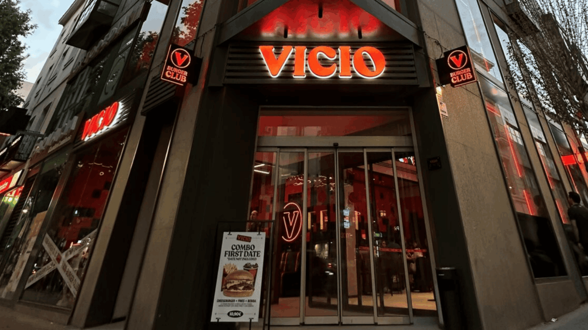 entrada de vicio burger con neón rojo