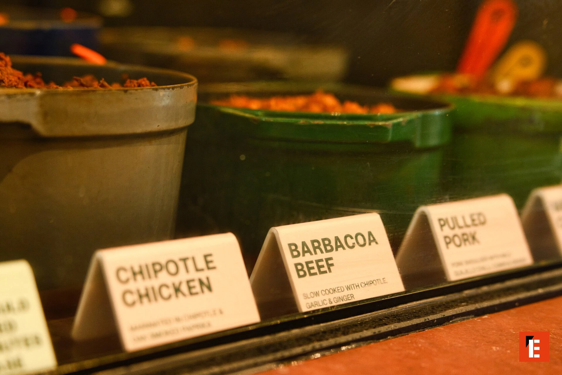 barbacoa and pulled pork taco counter close up