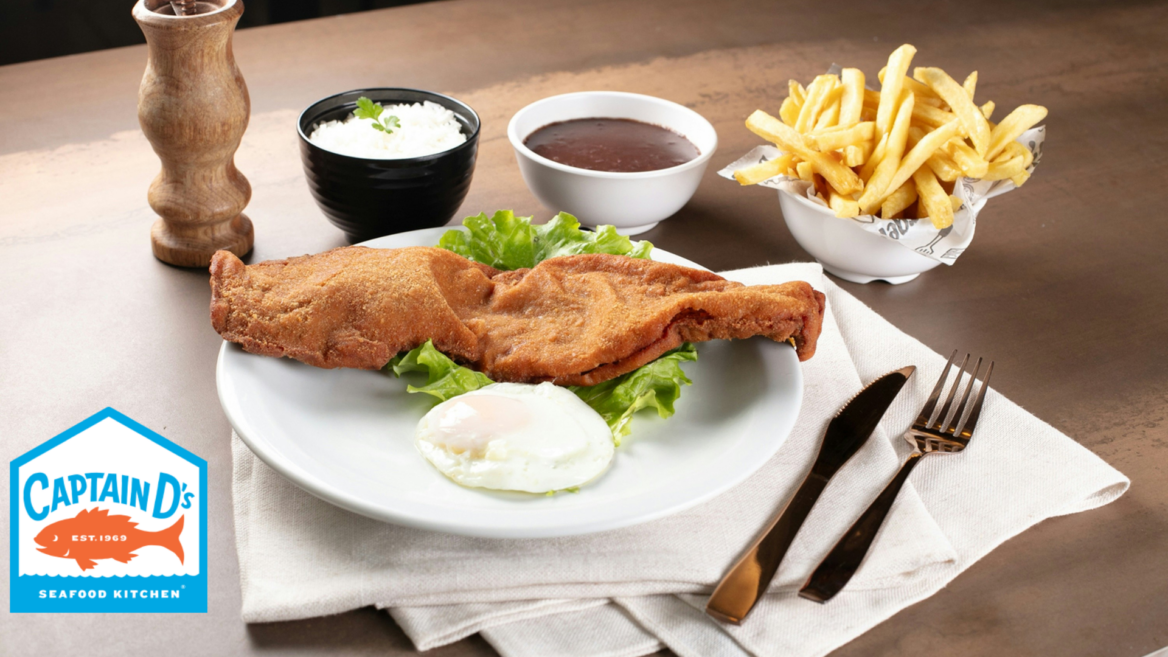 crispy breaded fish with fried egg, fries & rice