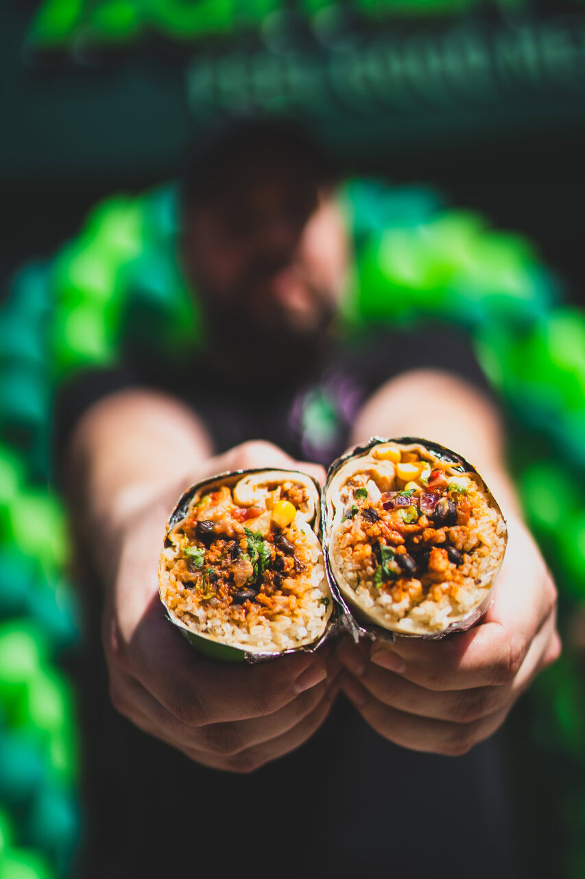 handheld burrito halves with rice, beans & corn