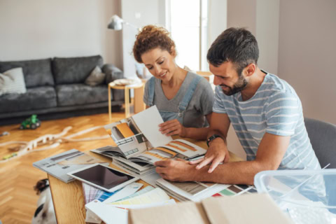 couple planning home renovation with colour swatches