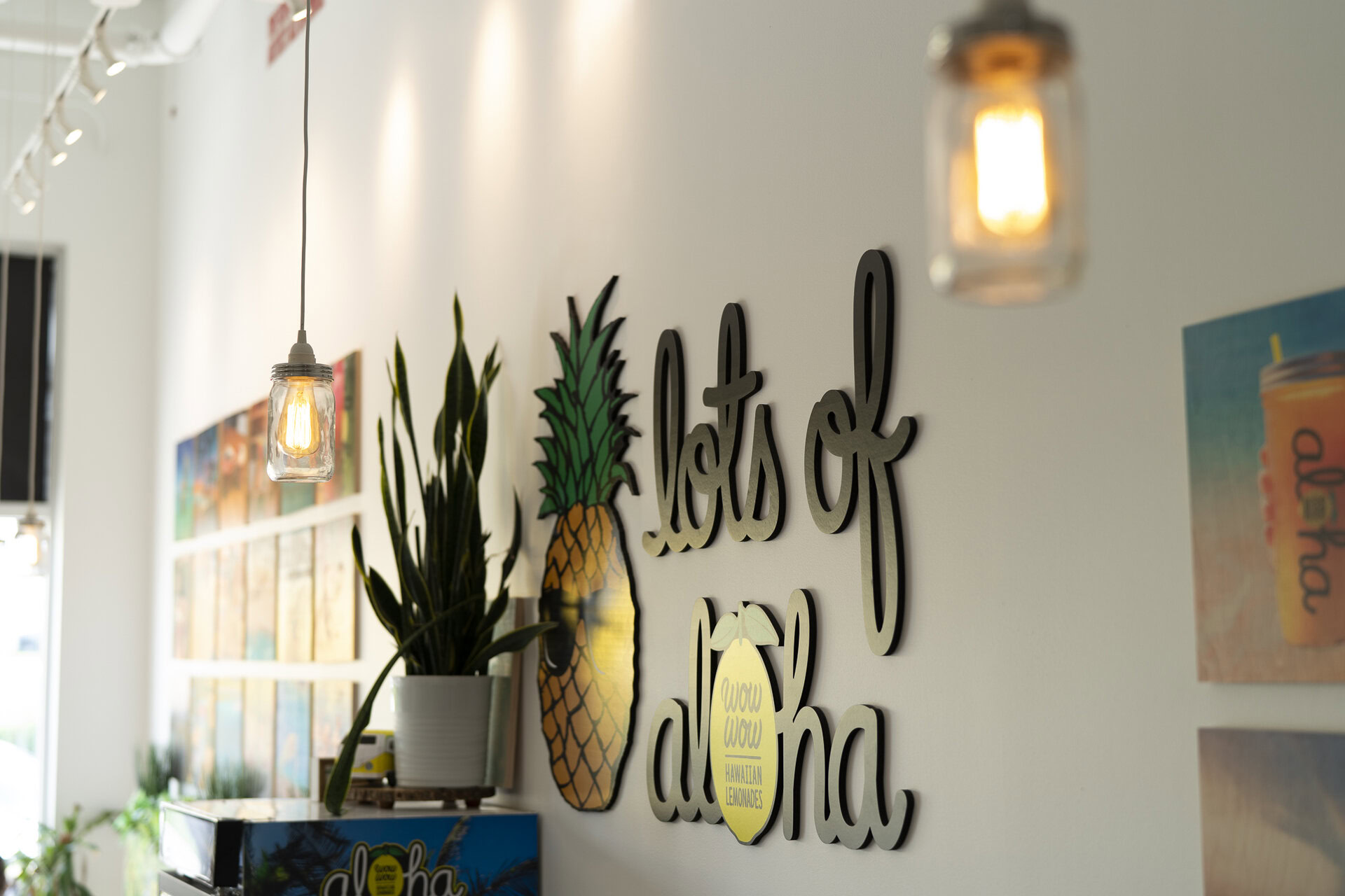 cozy tropical cafe interior with pineapple and mason jar lights