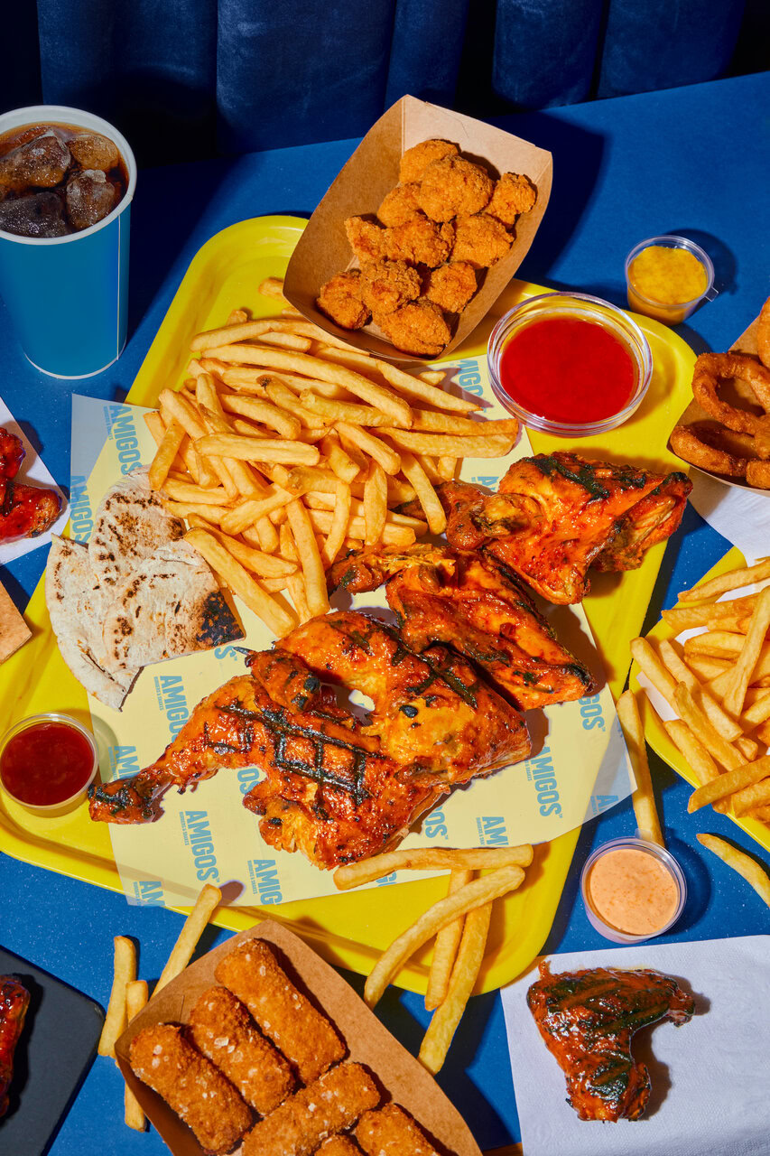 grilled glazed chicken platter with chips and sides