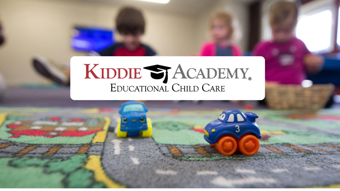kiddie academy childcare playroom with toy cars