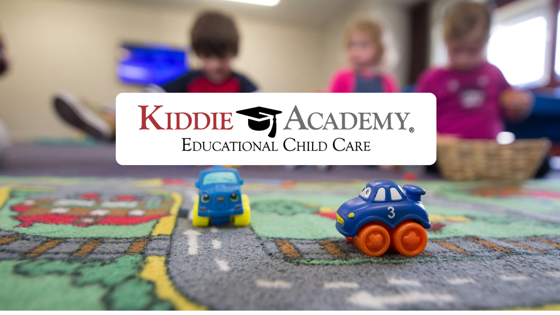 kiddie academy childcare playroom with toy cars