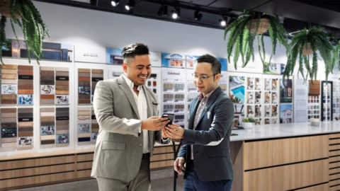 design showroom: two men reviewing material samples