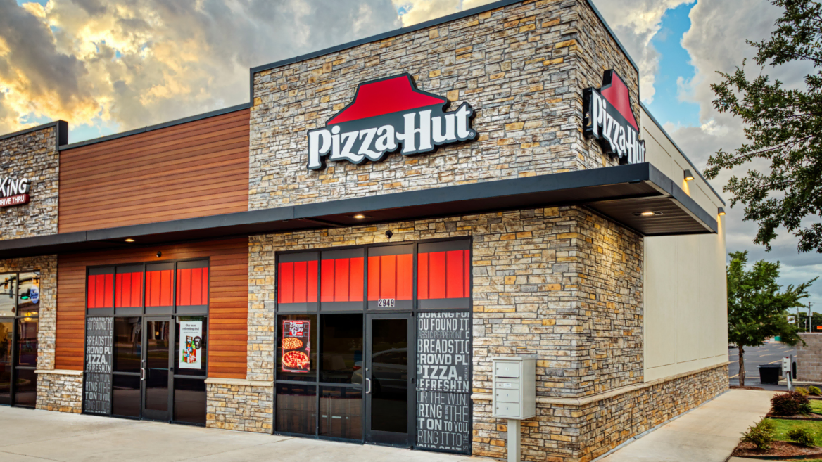 modern pizza hut storefront with red roof sign