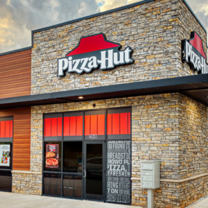 modern pizza hut storefront with red roof sign