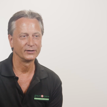 casual studio headshot of middle aged man