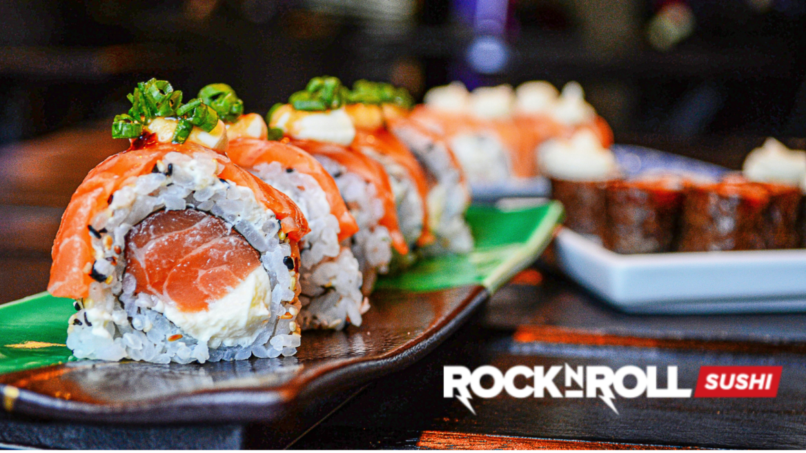 fresh salmon sushi roll close up with sesame