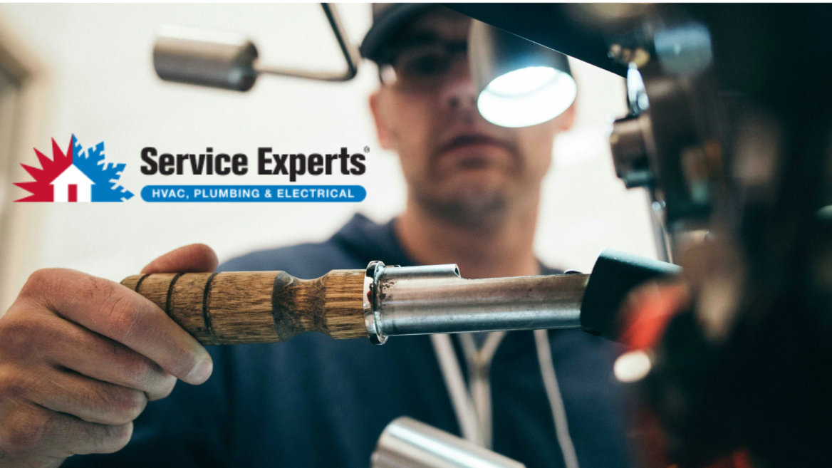 service experts technician repairing hvac, plumbing & electrical