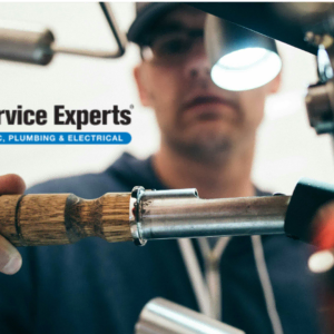 service experts technician repairing hvac, plumbing & electrical