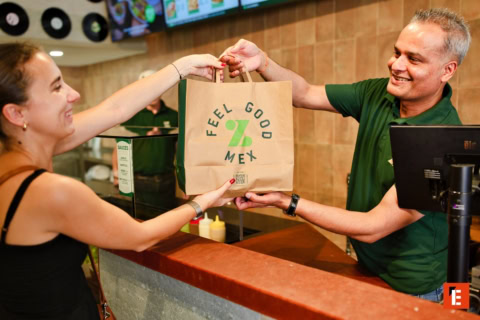 smiling customer collects feel good mex takeaway