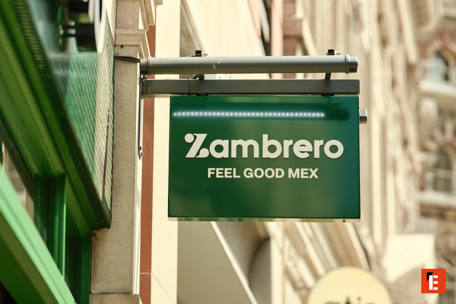 zambrero green shop sign with street lamp