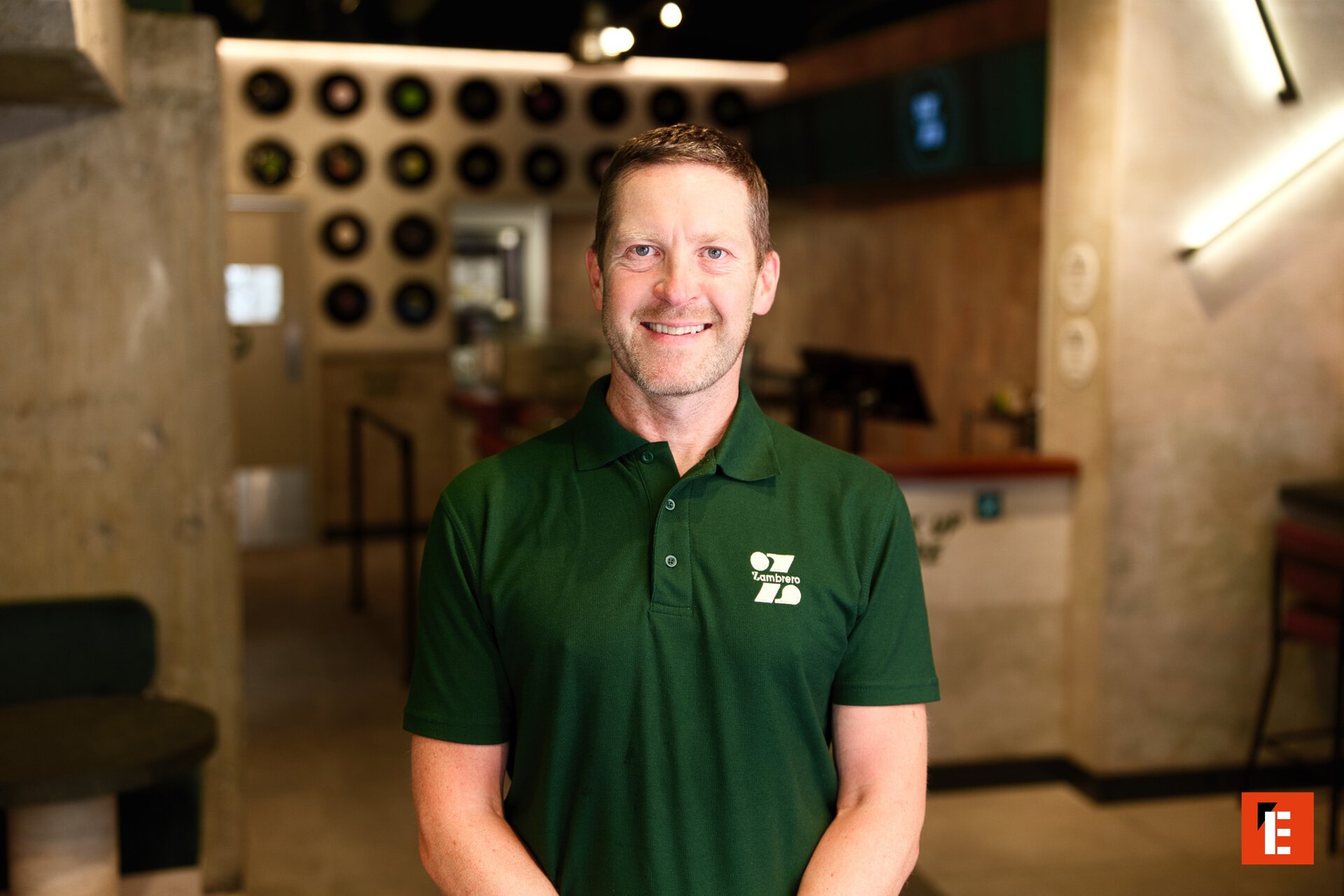 zambrero staff headshot smiling in green polo