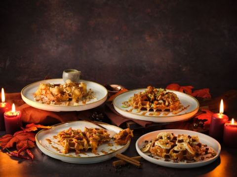 autumn waffles with candles, bananas and cinnamon