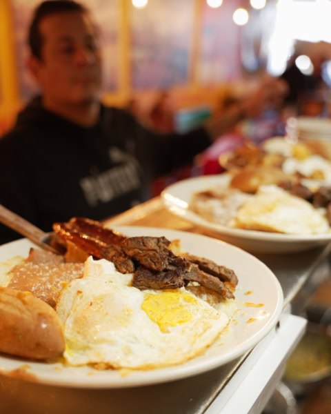 hearty breakfast plate in warm restaurant light