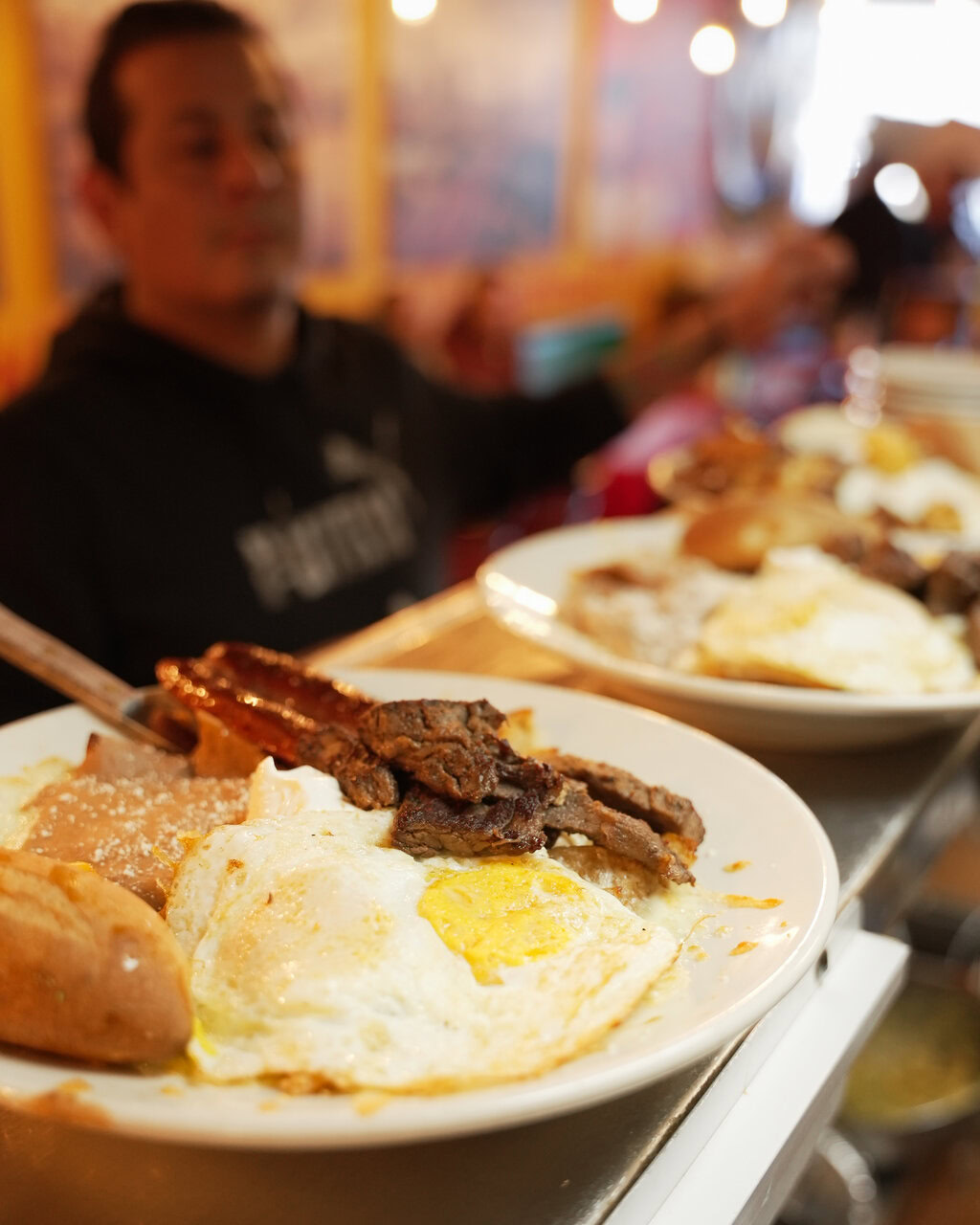 hearty breakfast plate in warm restaurant light