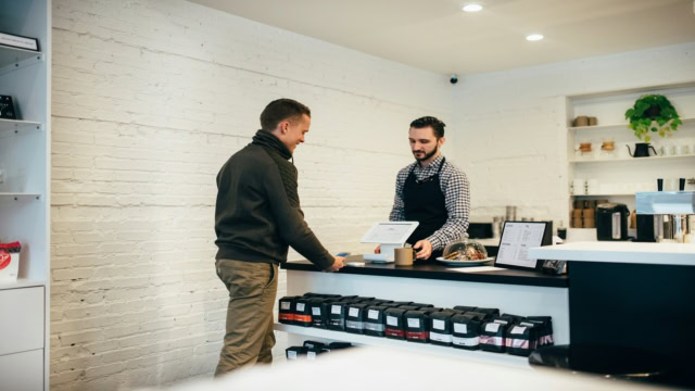 paiement mobile au comptoir dun café minimaliste