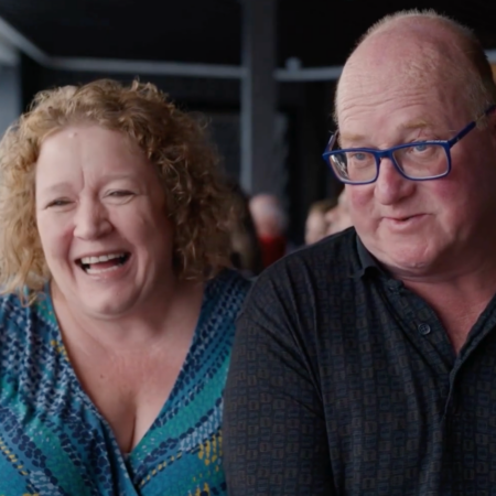 intimate candid portrait of a laughing couple