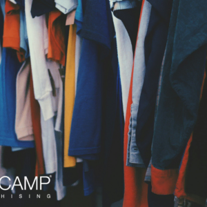 assorted shirts and jackets on clothing rack