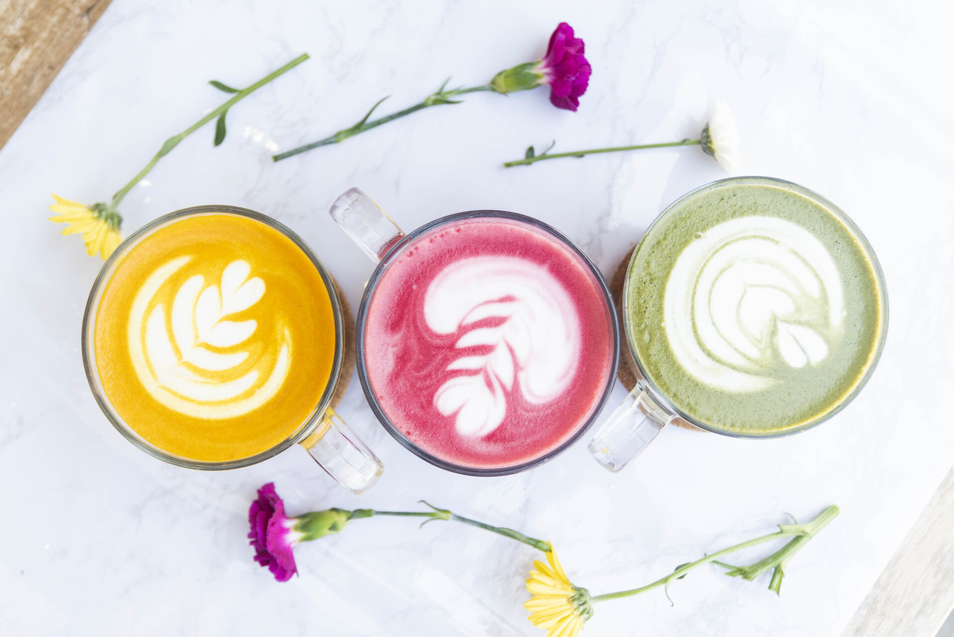 colorful latte art cups with flowers