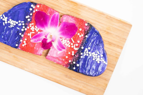 colorful orchid dessert with glossy frosting