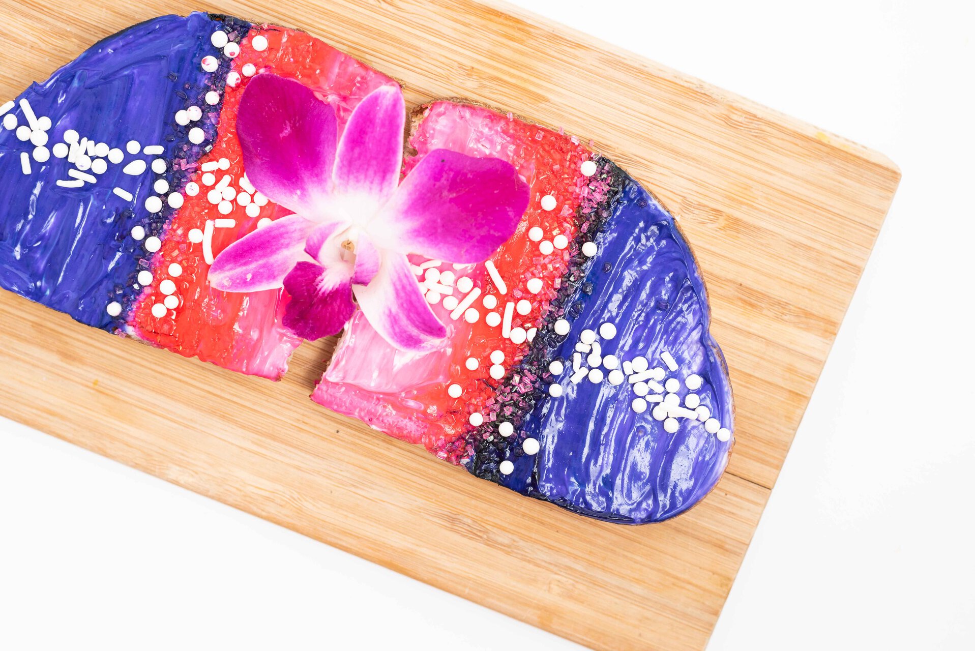 colorful orchid dessert with glossy frosting