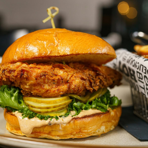 crispy fried chicken sandwich with seasoned fries