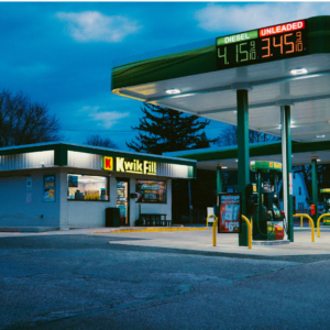 twilight gas station with empty lit canopy