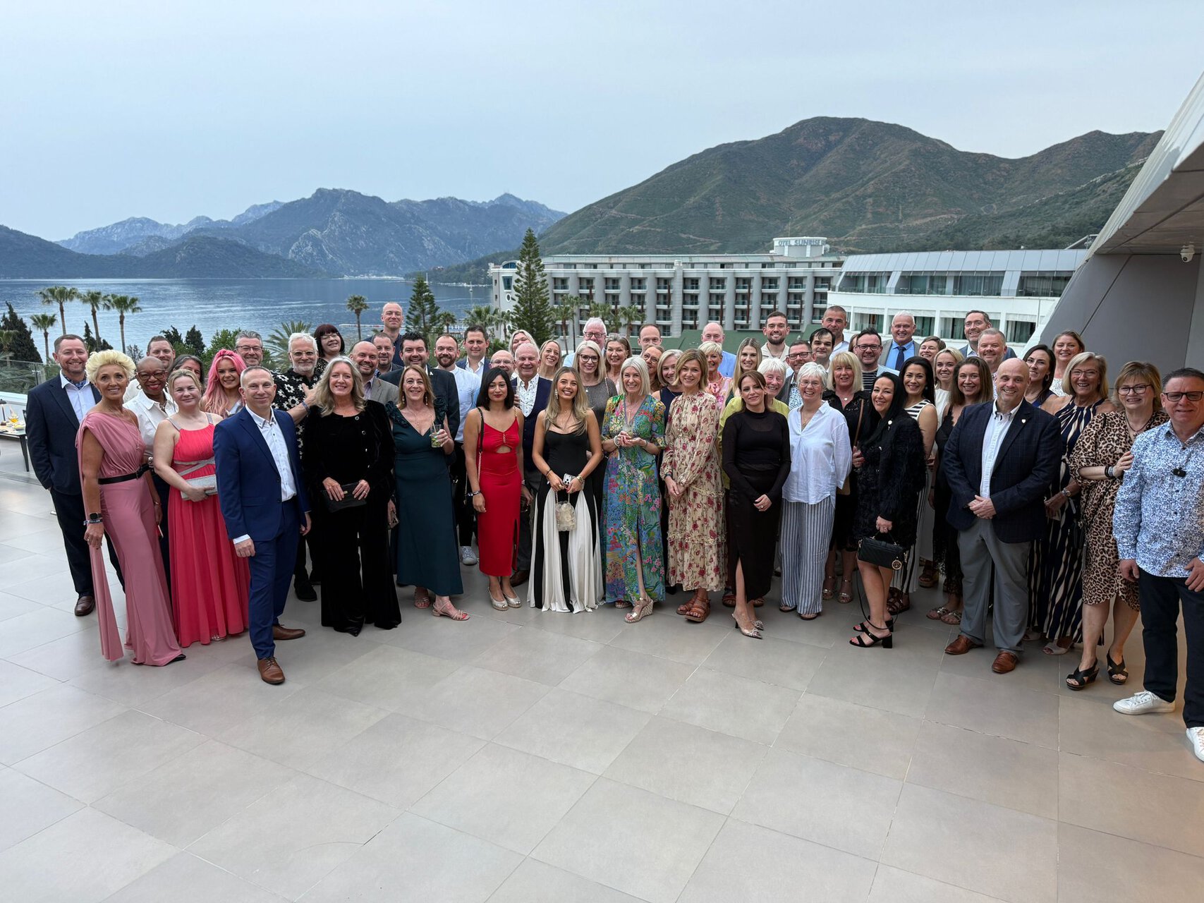 resort terrace group photo by the sea