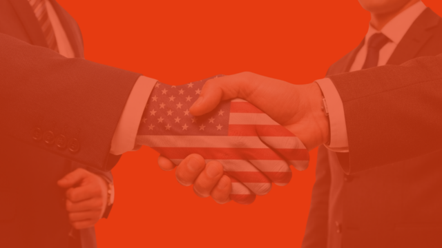american business handshake with flag overlay