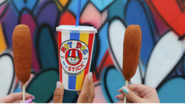 colorful corn dogs with hot dog on a stick cup