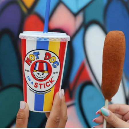 colorful corn dogs with hot dog on a stick cup