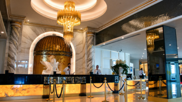 luxury hotel lobby with marble and chandelier