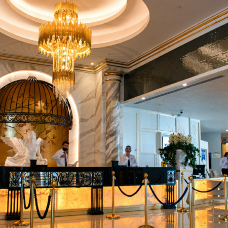 luxury hotel lobby with marble and chandelier