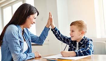 mother and son celebrate homework success