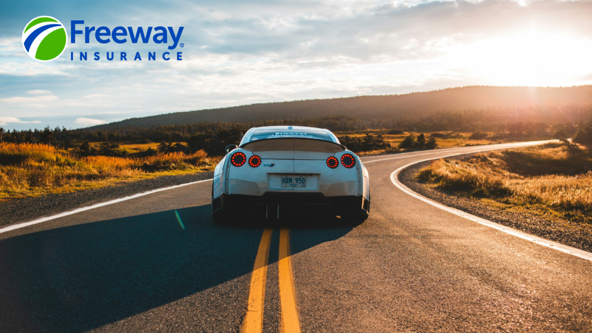 white sports car on scenic rural road