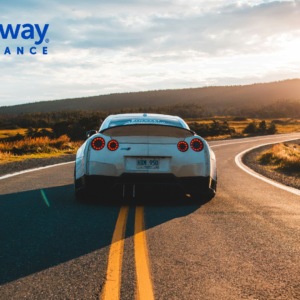 white sports car on scenic rural road