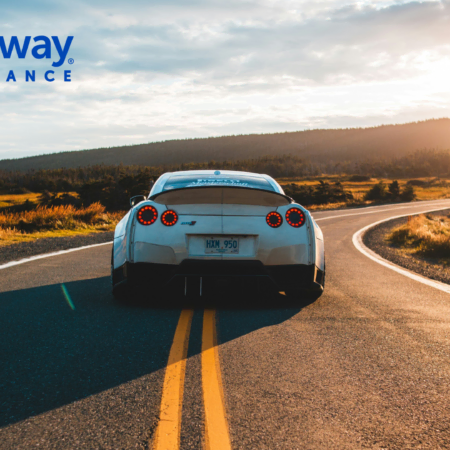 white sports car on scenic rural road