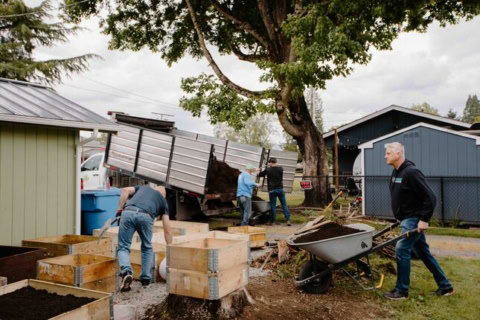 installing raised garden beds in backyard