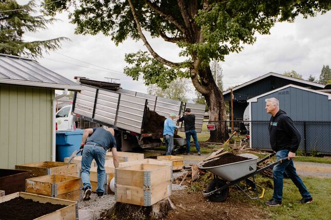 installing raised garden beds in backyard