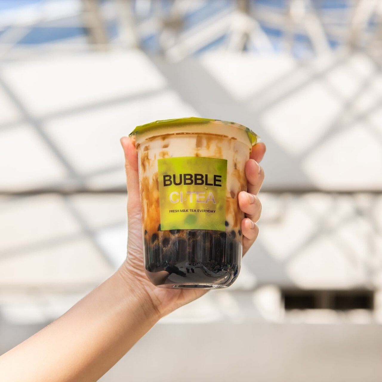 bubble tea cup with green lid
